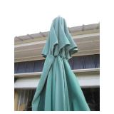 Patio umbrella with a milk can to hold it