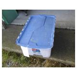 Clamshell closing tote containing a...