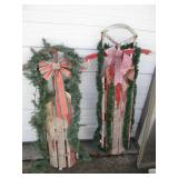 Pair of Vintage toboggan sleds hugg...