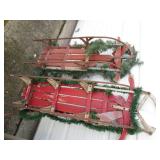 Pair of Vintage toboggan sleds hugg...