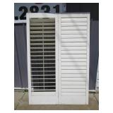 Trio of slotted wood closet doors...