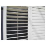 Trio of slotted wood closet doors...