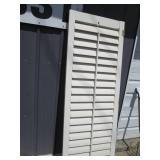 Trio of slotted wood closet doors...