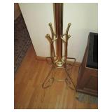 Freestanding brass tone hat and coa...