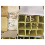 Gold rimmed floral etched stemware ...