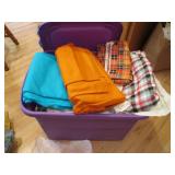 Covered tote full of assorted fabri...