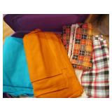 Covered tote full of assorted fabri...