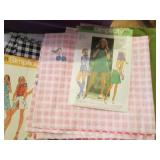 Covered tote full of fabrics, mater...