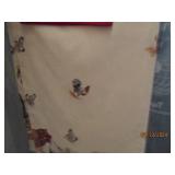 Group of linens with hangers...