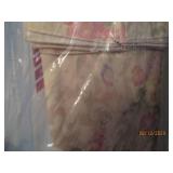 Group of linens with hangers...