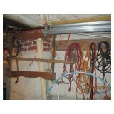 Items hanging in garage cords, shel...