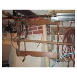 Items hanging in garage cords, shel...