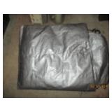 Can opener, roll of plastic and tarp