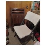 3 folding chairs. 1 plastic and 2 wooden