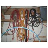 Items hanging in garage cords, shel...