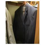 Closet contents. Mens button up shirts, dress pants, hats, blankets and more