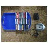 Portable CD and cassette players along with a case of Christmas cassette tapes