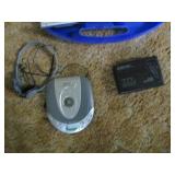Portable CD and cassette players along with a case of Christmas cassette tapes