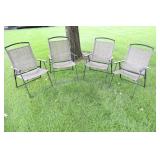 A Set Of Four Tan Lawn Chairs