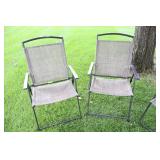 A Set Of Four Tan Lawn Chairs