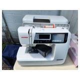 Janome Sewing Machine with Rolling Case