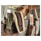 Equine Supplies - (6) Lead Ropes, (1) Bridle, Assorted Bits, (5) Halters, (9) Cinchers, (3) Buggy Whips, Leg Wraps, Saddle Bag, Box of Brushes and Hoof Tools