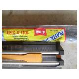 Plastic sheeting and a tile cutter...