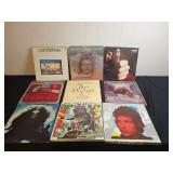 Collection of Classic Vinyl Records Featuring Various Artists
