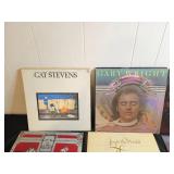Collection of Classic Vinyl Records Featuring Various Artists