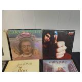 Collection of Classic Vinyl Records Featuring Various Artists