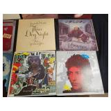 Collection of Classic Vinyl Records Featuring Various Artists