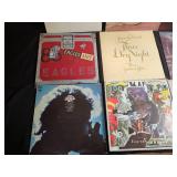 Collection of Classic Vinyl Records Featuring Various Artists