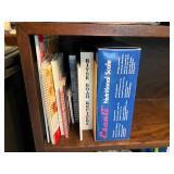 Wood Bookshelf with Cookbooks and Gardening Supplies