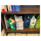 Wood Bookshelf with Cookbooks and Gardening Supplies