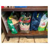 Wood Bookshelf with Cookbooks and Gardening Supplies