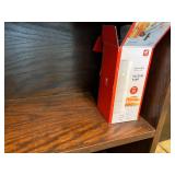 Wood Bookshelf with Cookbooks and Gardening Supplies