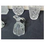 Collection of Crystal Glassware Including Decanters, Vases, and Pitchers