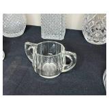 Collection of Crystal Glassware Including Decanters, Vases, and Pitchers