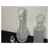 Collection of Crystal Glassware Including Decanters, Vases, and Pitchers