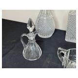 Collection of Crystal Glassware Including Decanters, Vases, and Pitchers