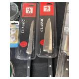 Lot of Various Kitchen Items Including Henckels Knives, Glassware, and Baking Trays