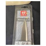 Lot of Various Kitchen Items Including Henckels Knives, Glassware, and Baking Trays
