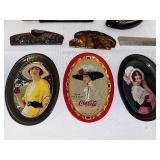 Antique Combs, Hairbrushes, and Coca-Cola Decorative Platters.