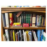 Top Shelf of Various Books as Seen in Photo.