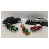 Four Model Cars and Wooden Train. Mercedes-Benz 300SL, Volvo PV 544, 1934 Duesenberg, 1937 Cord 812.