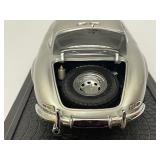 Four Model Cars and Wooden Train. Mercedes-Benz 300SL, Volvo PV 544, 1934 Duesenberg, 1937 Cord 812.