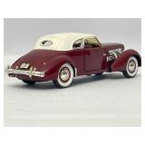 Four Model Cars and Wooden Train. Mercedes-Benz 300SL, Volvo PV 544, 1934 Duesenberg, 1937 Cord 812.