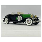 Four Model Cars and Wooden Train. Mercedes-Benz 300SL, Volvo PV 544, 1934 Duesenberg, 1937 Cord 812.