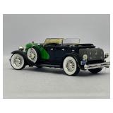 Four Model Cars and Wooden Train. Mercedes-Benz 300SL, Volvo PV 544, 1934 Duesenberg, 1937 Cord 812.