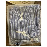 Bin of New and Used Pajama Tops and Bottoms.